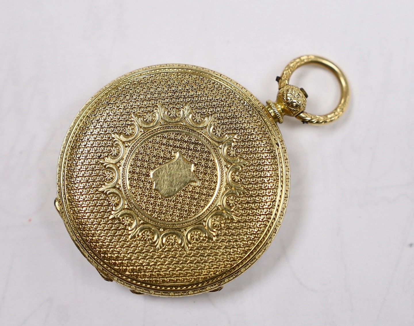 A continental engraved yellow metal open faced fob watch, with Roman dial, case diameter 38mm, gross weight 39.9 grams.